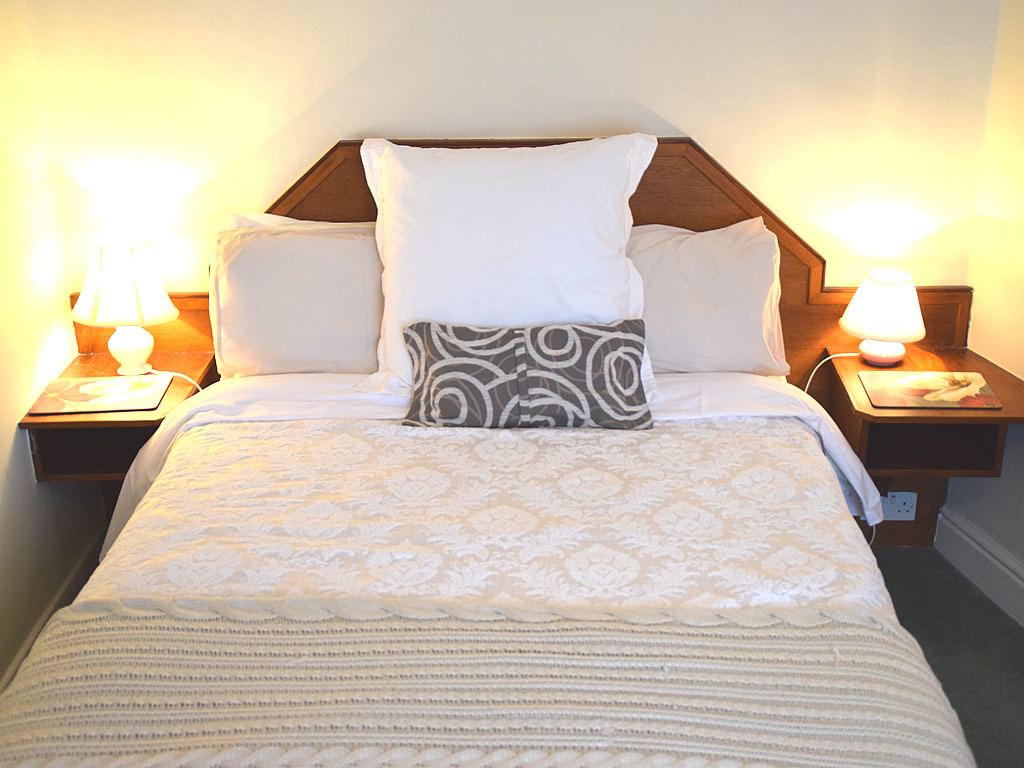A bright, tastefully furnished room that can be set up as a double, twin or family room
